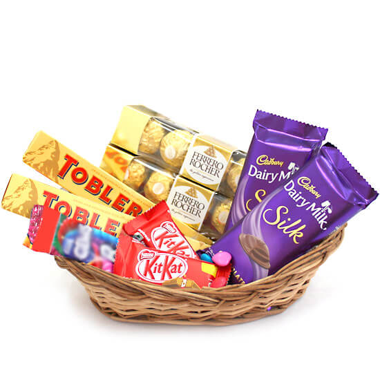 Chocolate gift hamper in a cane basket, delivered in Pakistan